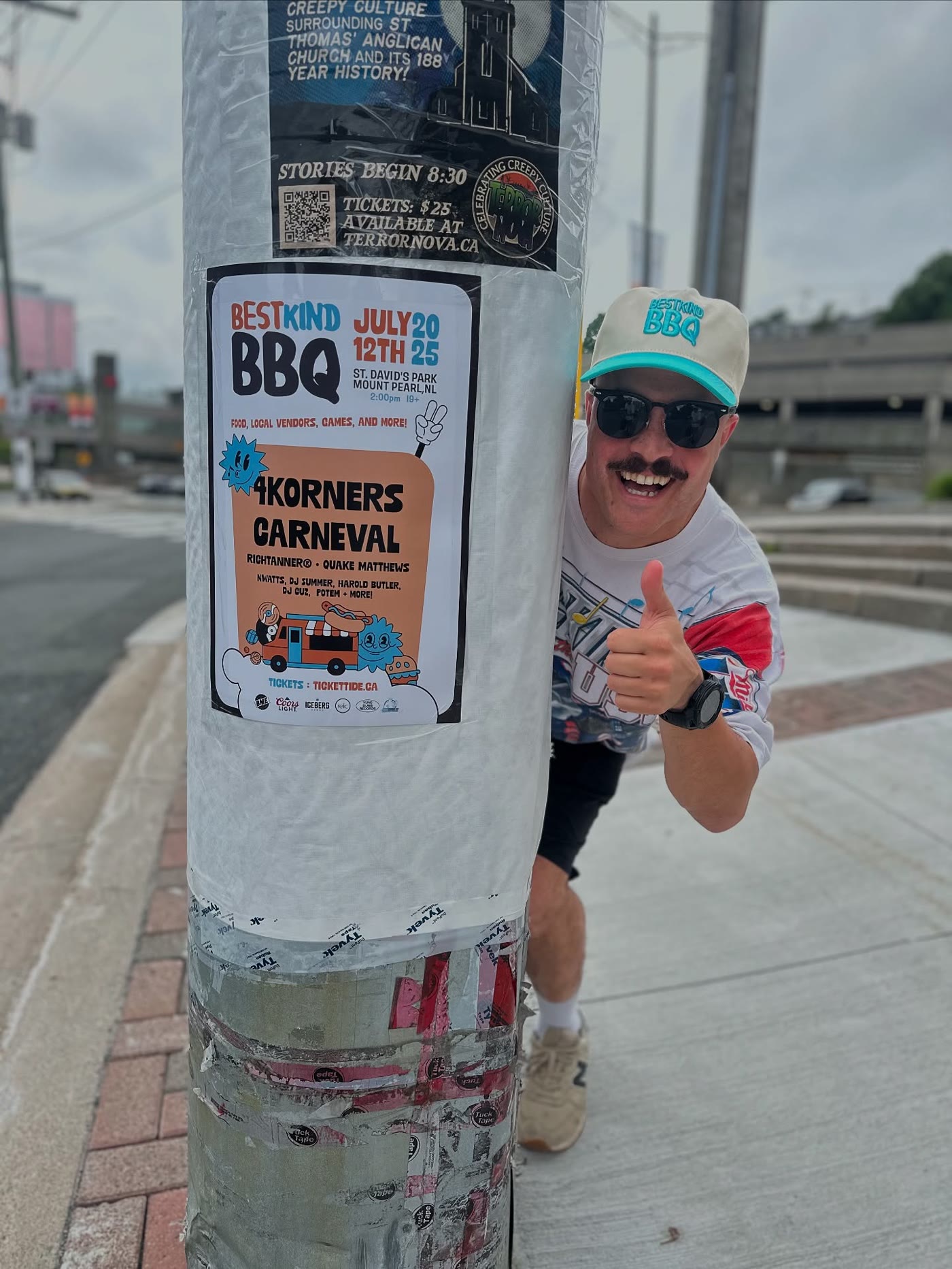 Brent Mac giving a thumbs up next to a BestKind BBQ poster