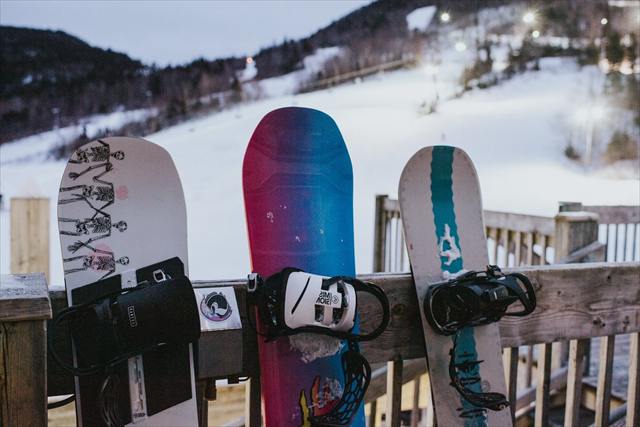 Snowboards lined up at Marble Mountain